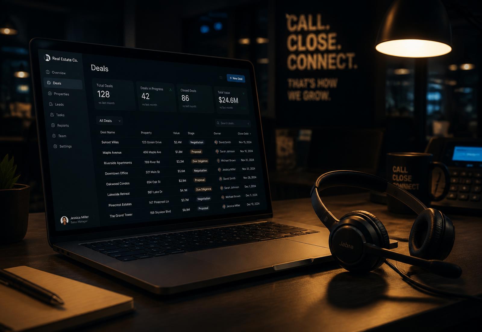 Cold calling workstation with headset and a real estate deal dashboard at night
